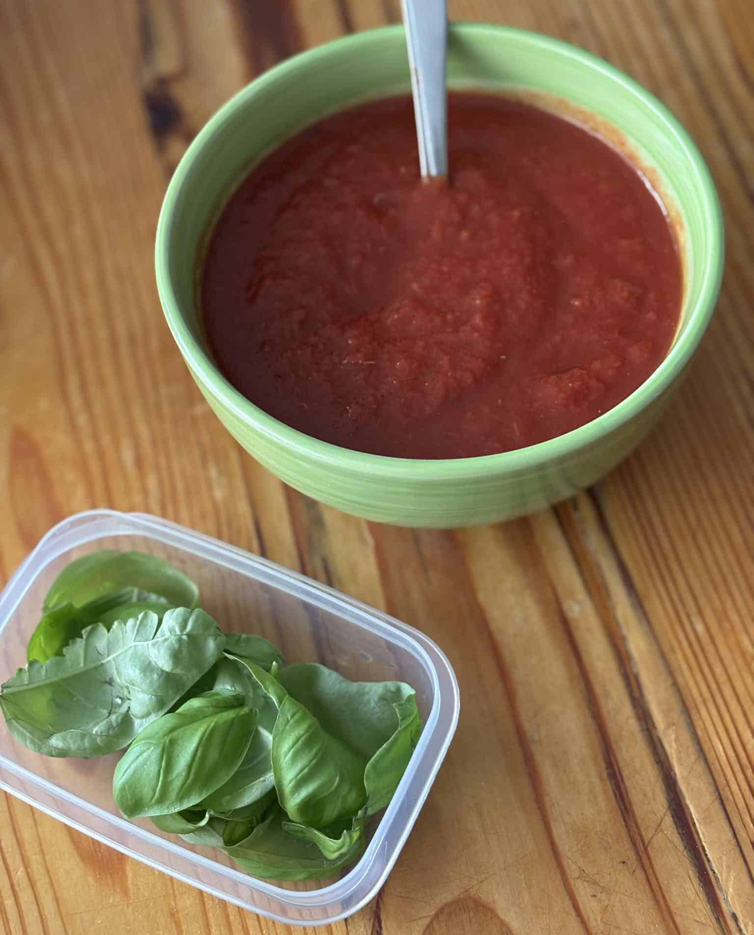 Tomato pizza sauce and basil